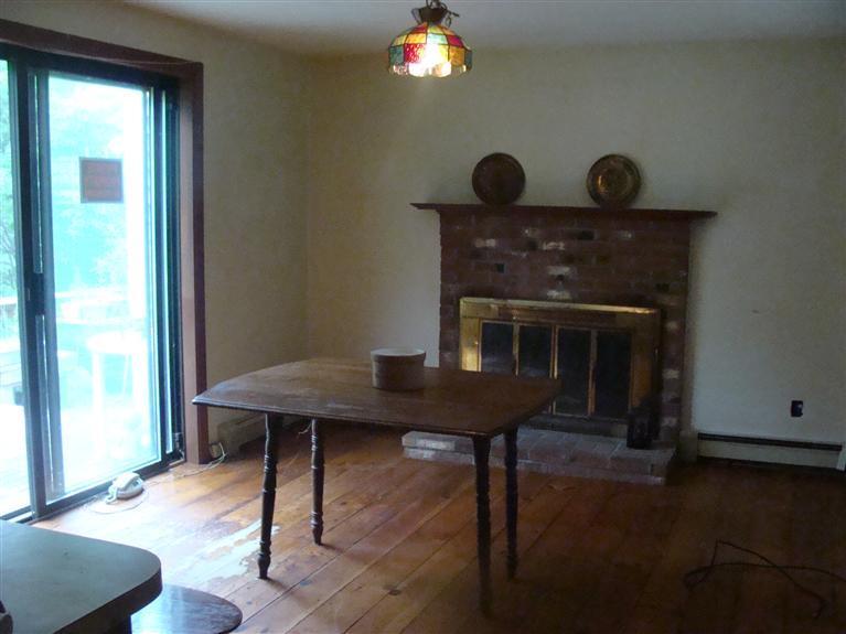 6 Hobbler Road Bourne, MA 02532 - Photo 3 of 21 a view of a livingroom with furniture and a fireplace