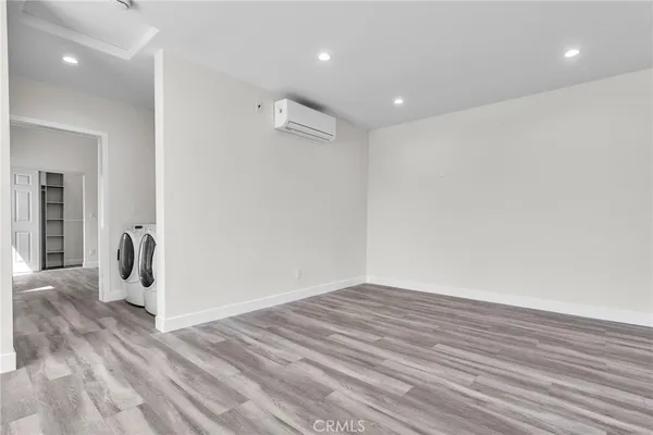a view of a livingroom with wooden floor