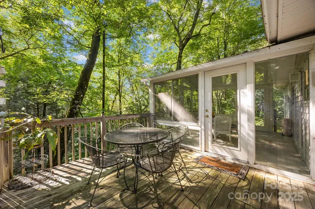 a view of a patio with table and chairs and potted plants