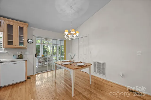 a kitchen with granite countertop cabinets stainless steel appliances and a sink