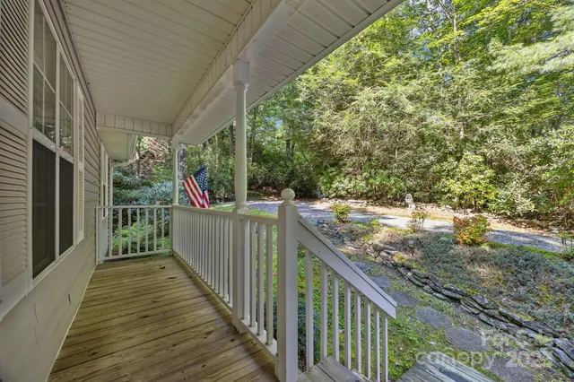 a view of a balcony with wooden floor