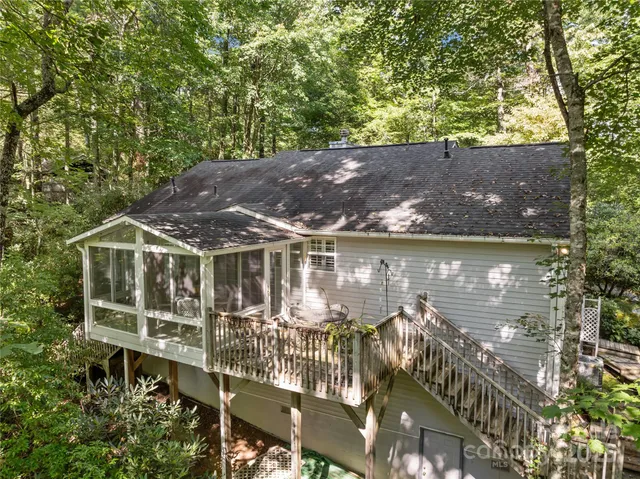 an aerial view of a house with lake view