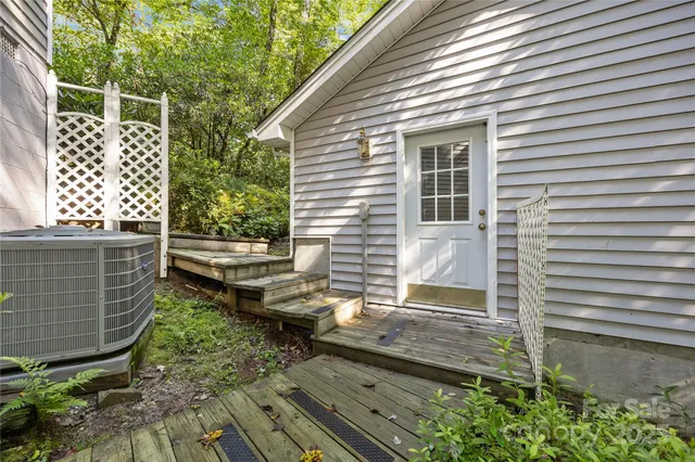 a backyard of a house with outdoor seating