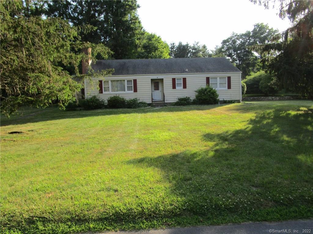 4 Coley Road Wilton, CT 06897 - Photo 1 of 1 a front view of house with yard and trees