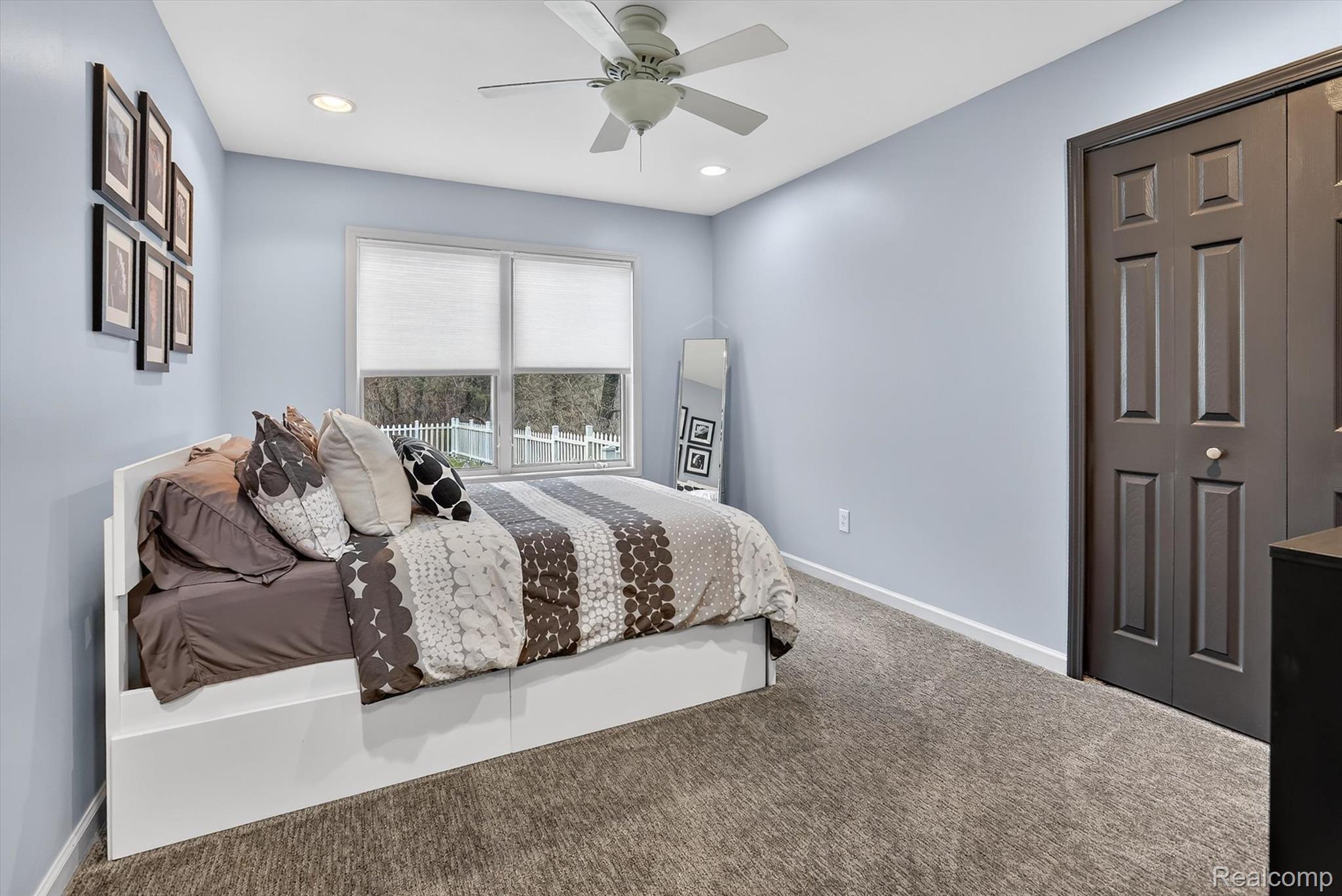 552 North McKinley Road Flushing, MI 48433 - Photo 43 of 98 Bedroom featuring a closet, carpet flooring, ceiling fan, and recessed lighting