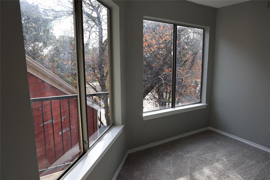 9805 Walnut Street, Unit 305C Dallas, TX 75243 - Photo 15 of 19 a view of an empty room with windows