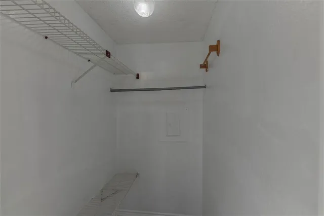 a view of an empty room with windows