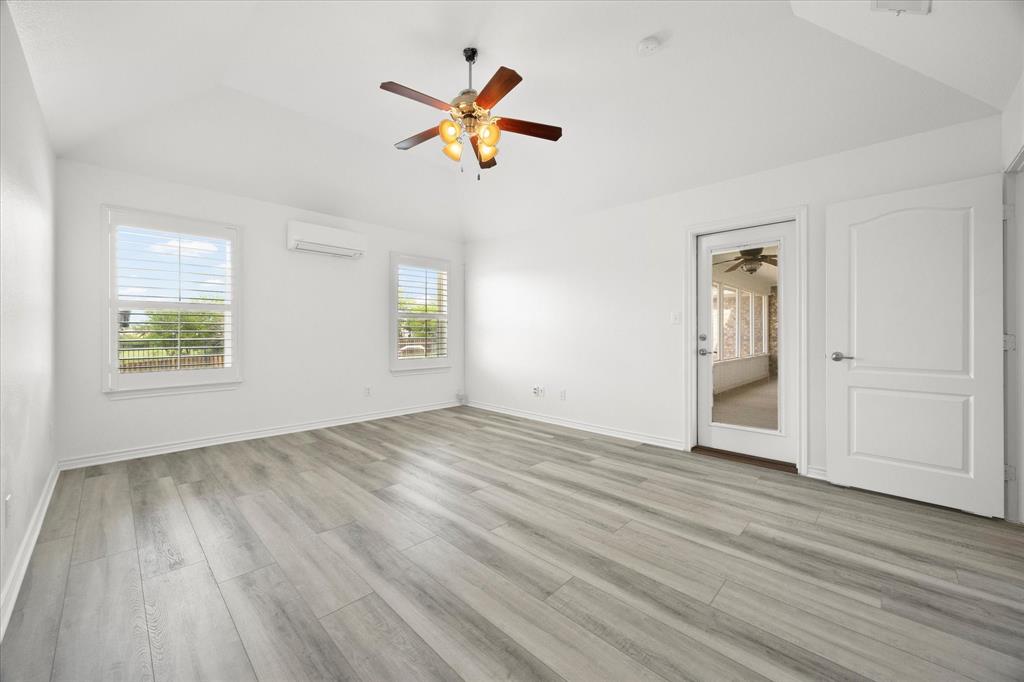 528 Hubbard Circle Nevada, TX 75173 - Photo 18 of 38 a view of empty room with wooden floor and window