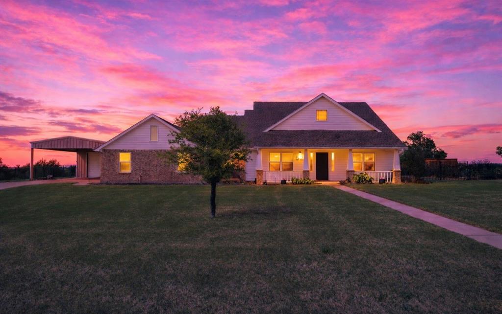 528 Hubbard Circle Nevada, TX 75173 - Photo 2 of 38 a front view of a house with a yard