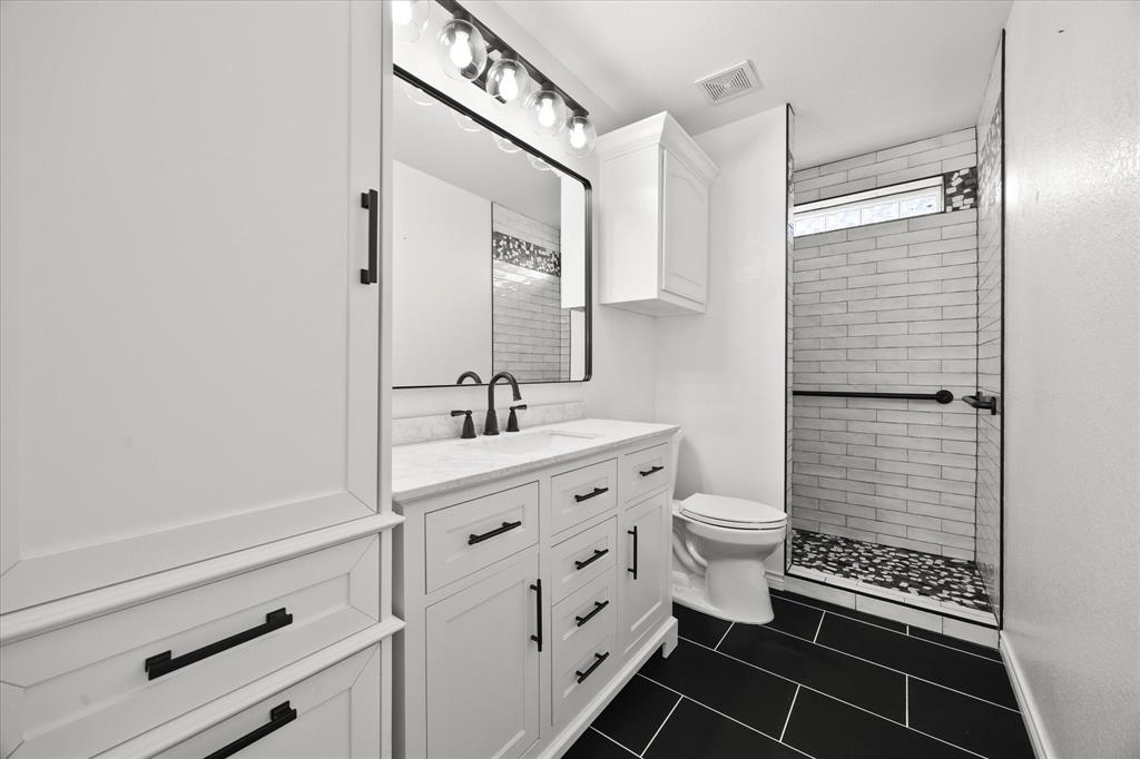 528 Hubbard Circle Nevada, TX 75173 - Photo 23 of 38 a bathroom with a sink a toilet and shower