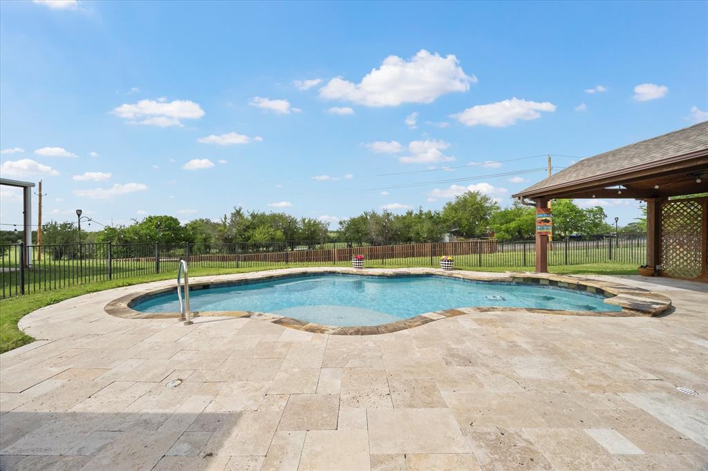 528 Hubbard Circle Nevada, TX 75173 - Photo 27 of 38 a view of a swimming pool and a yard