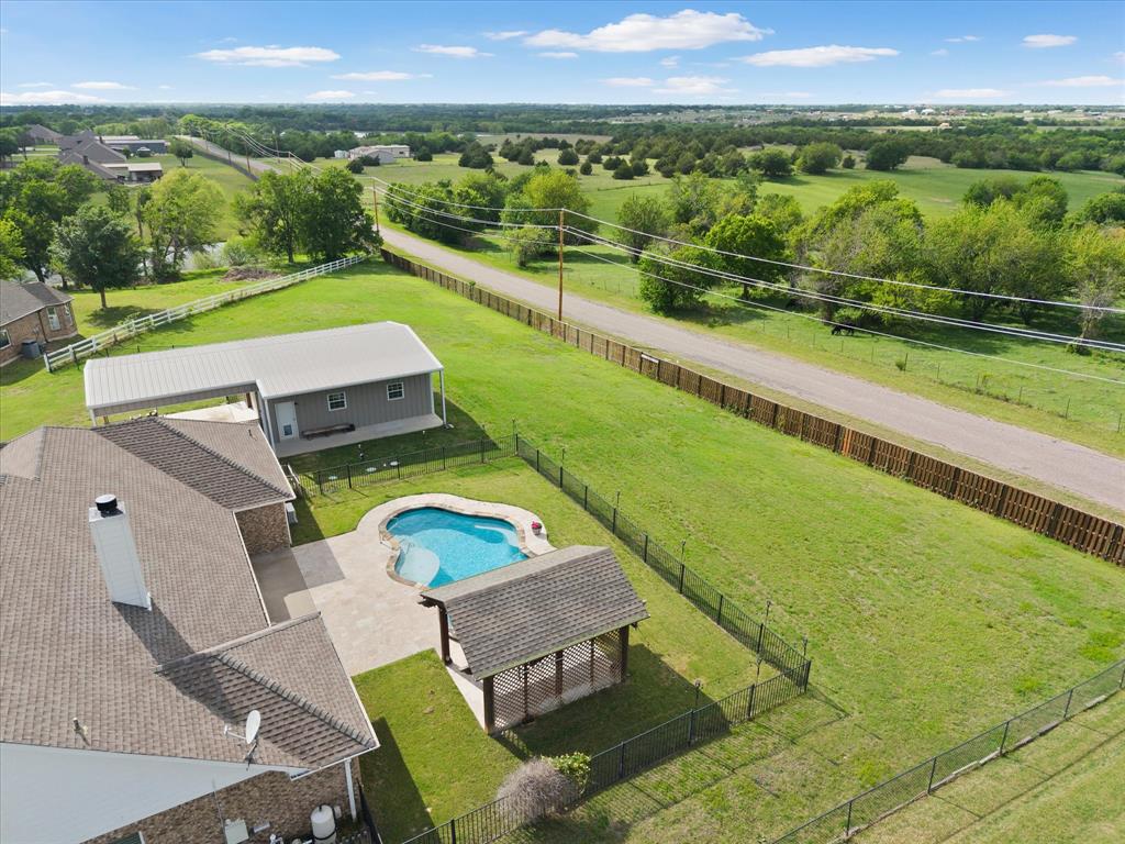 528 Hubbard Circle Nevada, TX 75173 - Photo 36 of 38 an aerial view of a house with a garden and lake view