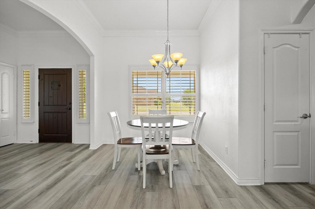 528 Hubbard Circle Nevada, TX 75173 - Photo 8 of 38 a view of a dining room with furniture window and wooden floor