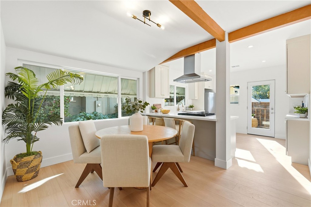 829 North Valley Street Burbank, CA 91505 - Photo 14 of 58 a dining room with furniture window and wooden floor