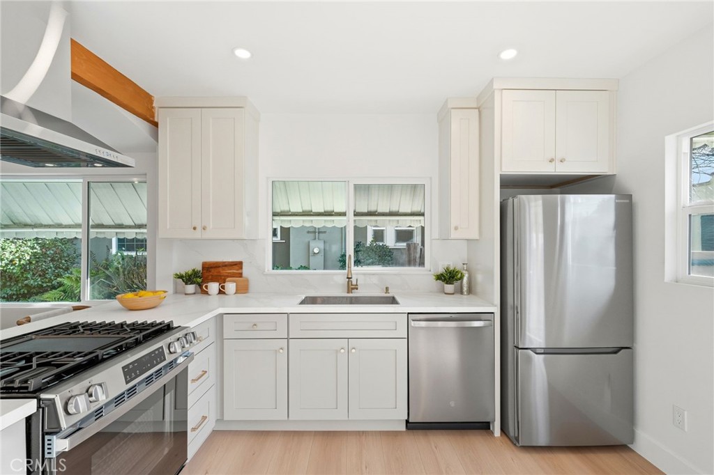 829 North Valley Street Burbank, CA 91505 - Photo 20 of 58 a kitchen with a white stove top oven and refrigerator