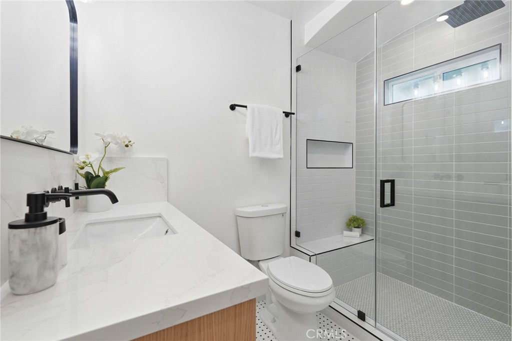 829 North Valley Street Burbank, CA 91505 - Photo 29 of 58 a bathroom with a sink a toilet and shower