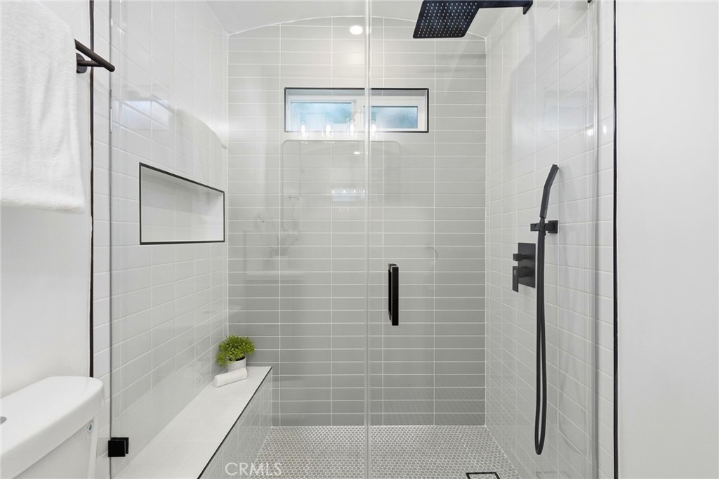 829 North Valley Street Burbank, CA 91505 - Photo 30 of 58 a bathroom with a shower and a bathtub