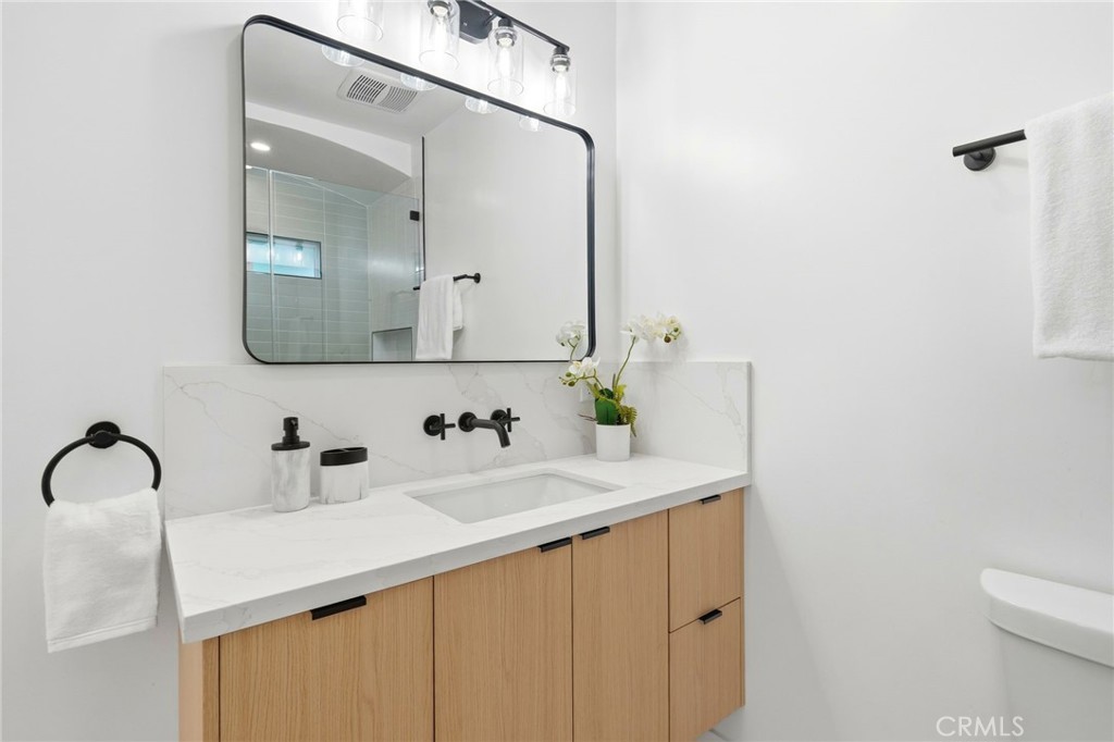 829 North Valley Street Burbank, CA 91505 - Photo 31 of 58 a bathroom with a sink vanity and a mirror