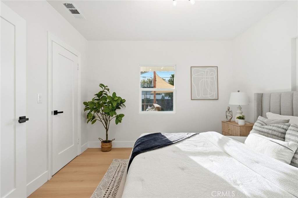 829 North Valley Street Burbank, CA 91505 - Photo 35 of 58 a bedroom with a bed and a potted plant
