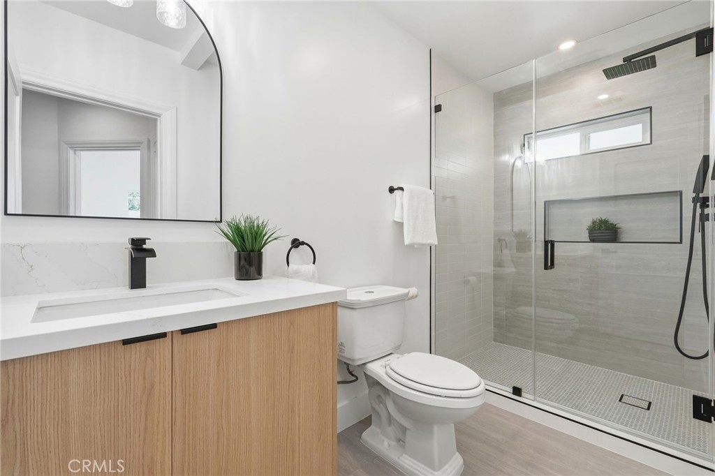 829 North Valley Street Burbank, CA 91505 - Photo 36 of 58 a bathroom with a sink a toilet and shower
