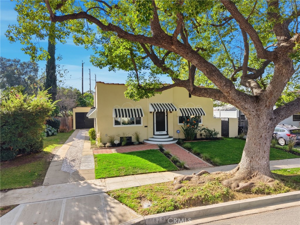 829 North Valley Street Burbank, CA 91505 - Photo 5 of 58 a front view of a house with a yard and a garden