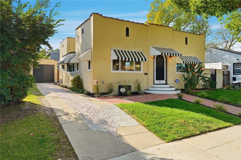 829 North Valley Street Burbank, CA 91505 - Photo 8 of 58 a view of a white house with a yard