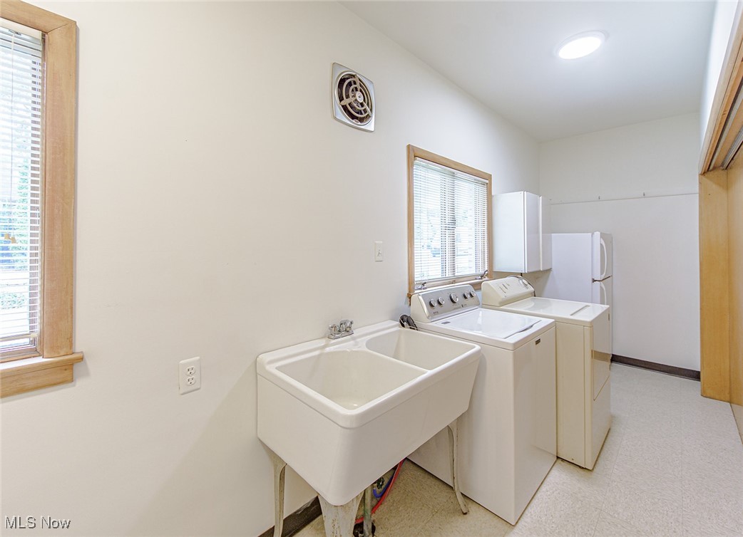 2445 Chatham Road Akron, OH 44313 - Photo 22 of 32 Sizable and bright Laundry/Mud room with utility tub is located on the main floor.