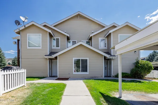 a view of a car parked in front of a building