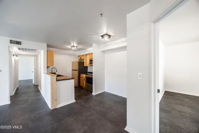 a view of living room with furniture and white walls