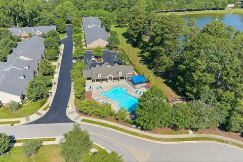 an aerial view of a house with a swimming pool yard and outdoor seating