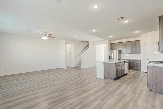 a view of kitchen with furniture and wooden floor
