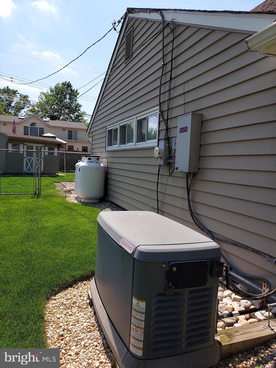 45 Seckelpear Road Levittown, PA 19056 - Photo 56 of 59 Generator and Propane tank