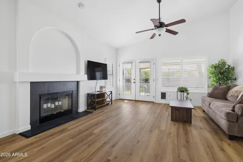 a living room with furniture and a fireplace