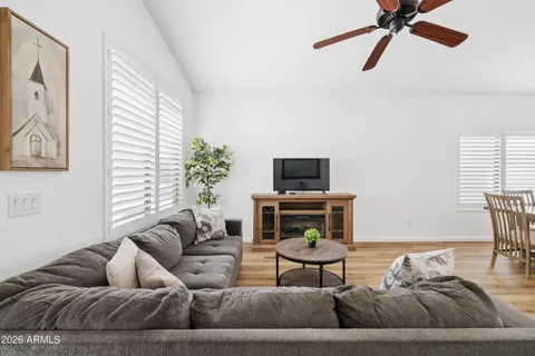 a living room with furniture and a window