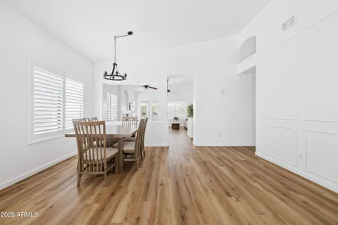 a view of a dining room with furniture window and wooden floor