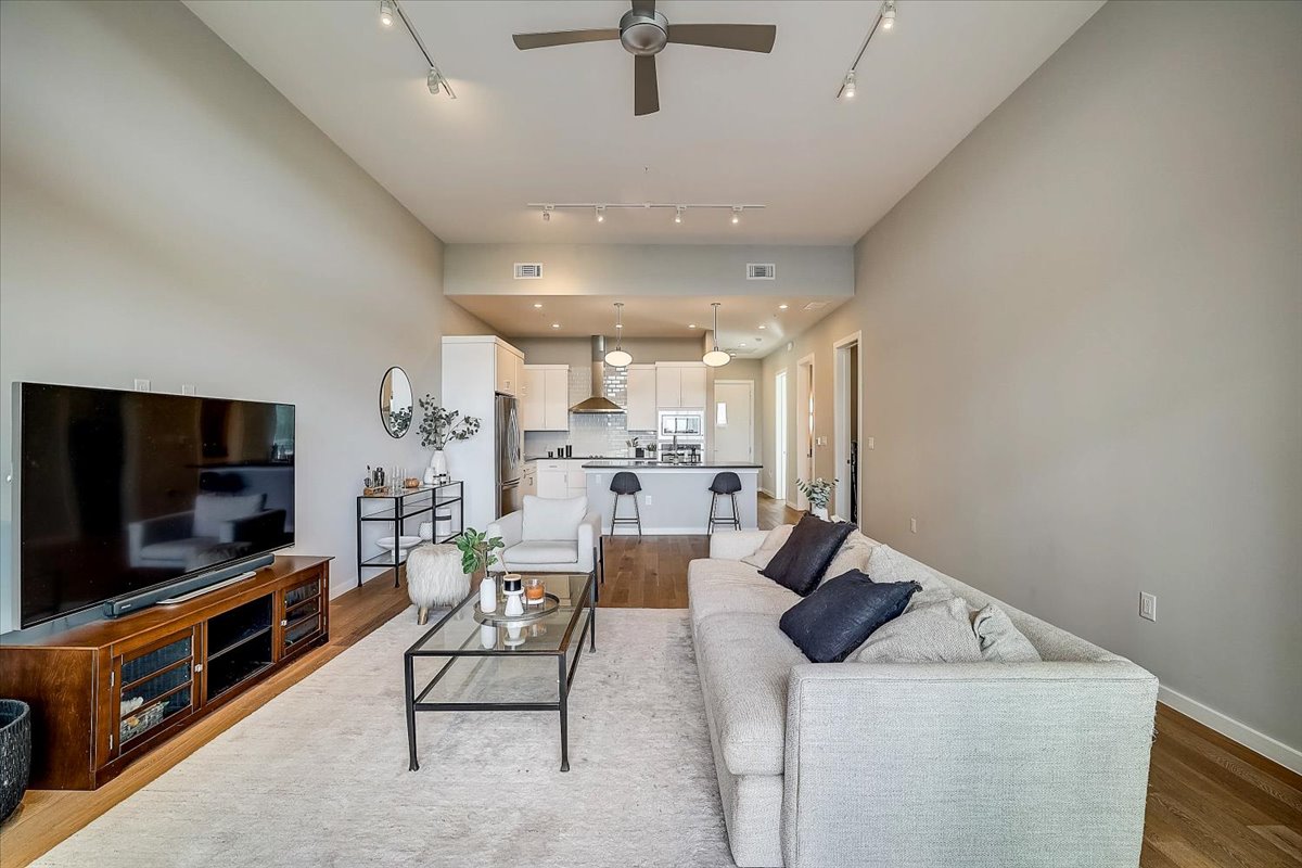 5921 Hiline Road, Unit 1204 Austin, TX 78734 - Photo 4 of 36 Living room featuring a ceiling fan and light wood-type flooring