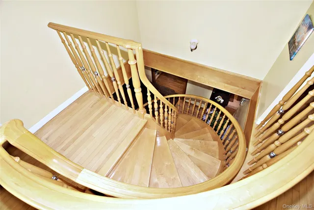 a bedroom with a bed and large window