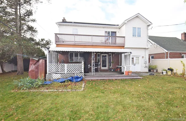 a front view of a house with outdoor seating