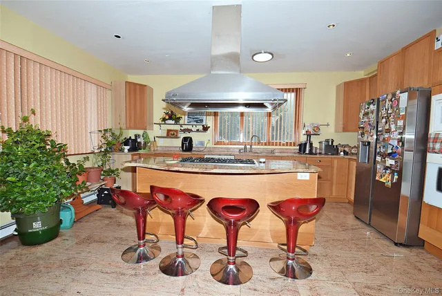 a dining table with chairs and window