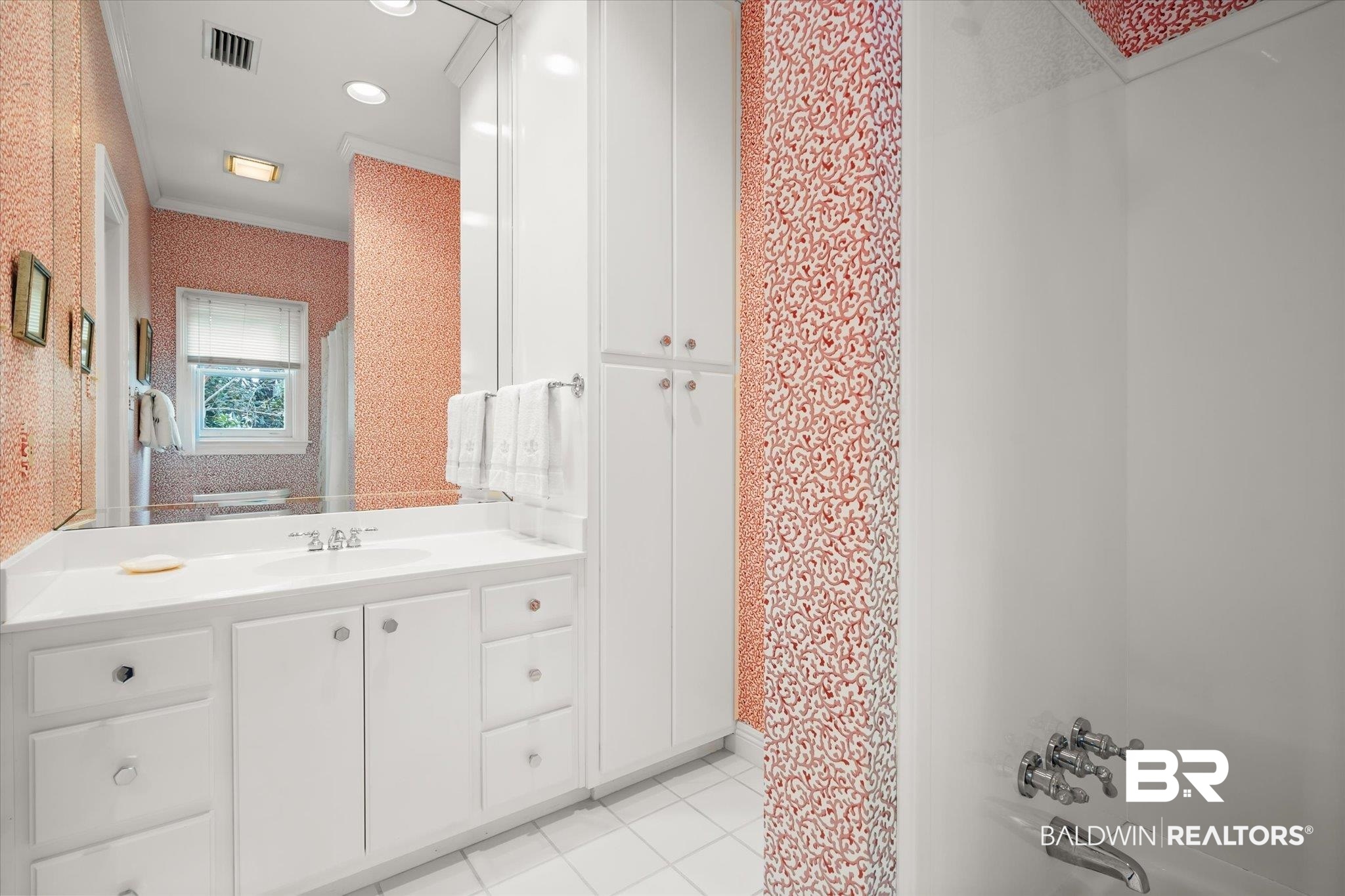 354 Dogwood Lane Mobile, AL 36608 - Photo 23 of 44 Bathroom with vanity, tile patterned floors, ornamental molding, and shower / bathtub combination with curtain