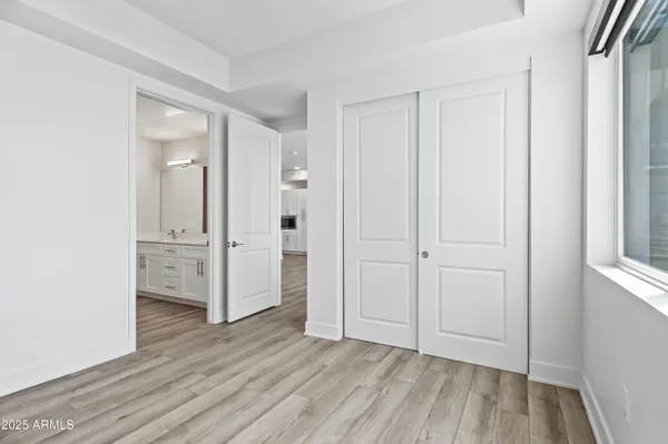 a front view of a building with a garden