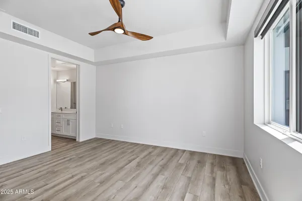 a bathroom with a double vanity sink and mirror