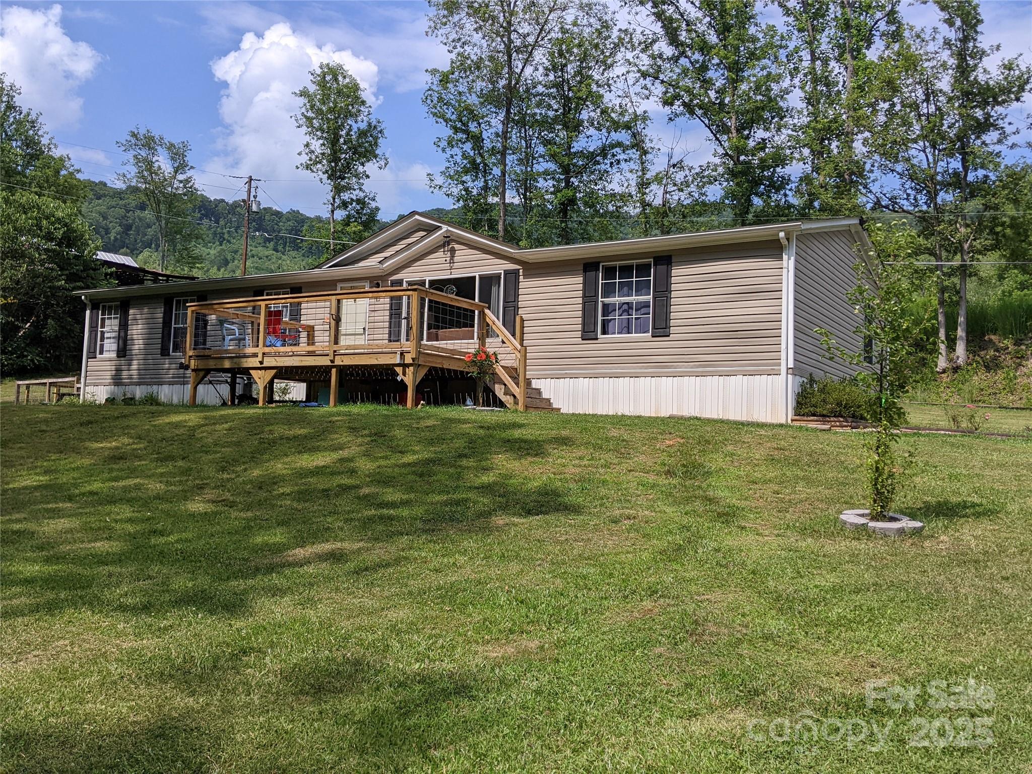 196 McKinney Road Weaverville, NC 28787 - Photo 1 of 20 a front view of a house with a yard