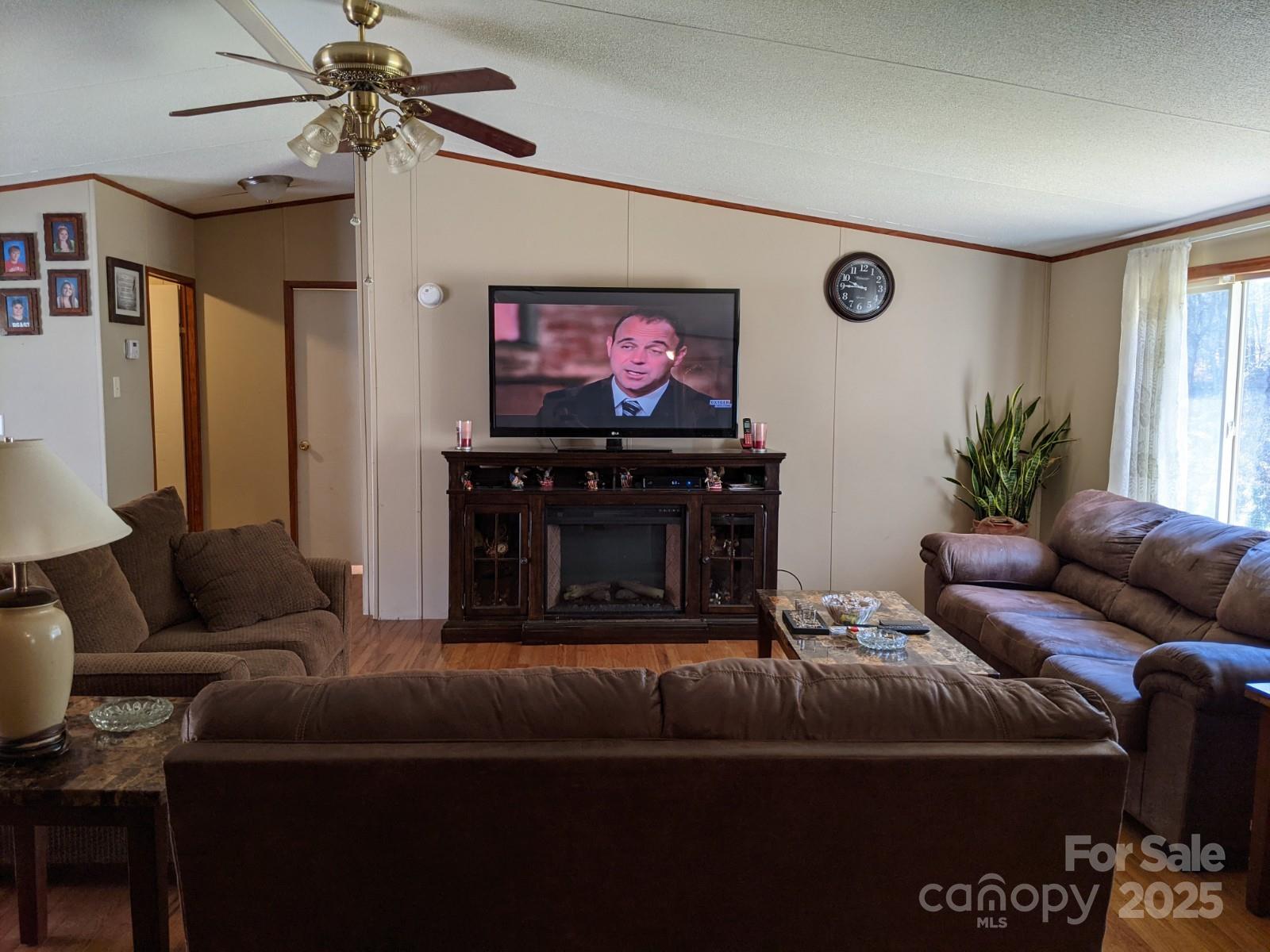 196 McKinney Road Weaverville, NC 28787 - Photo 3 of 20 a living room with furniture and a flat screen tv