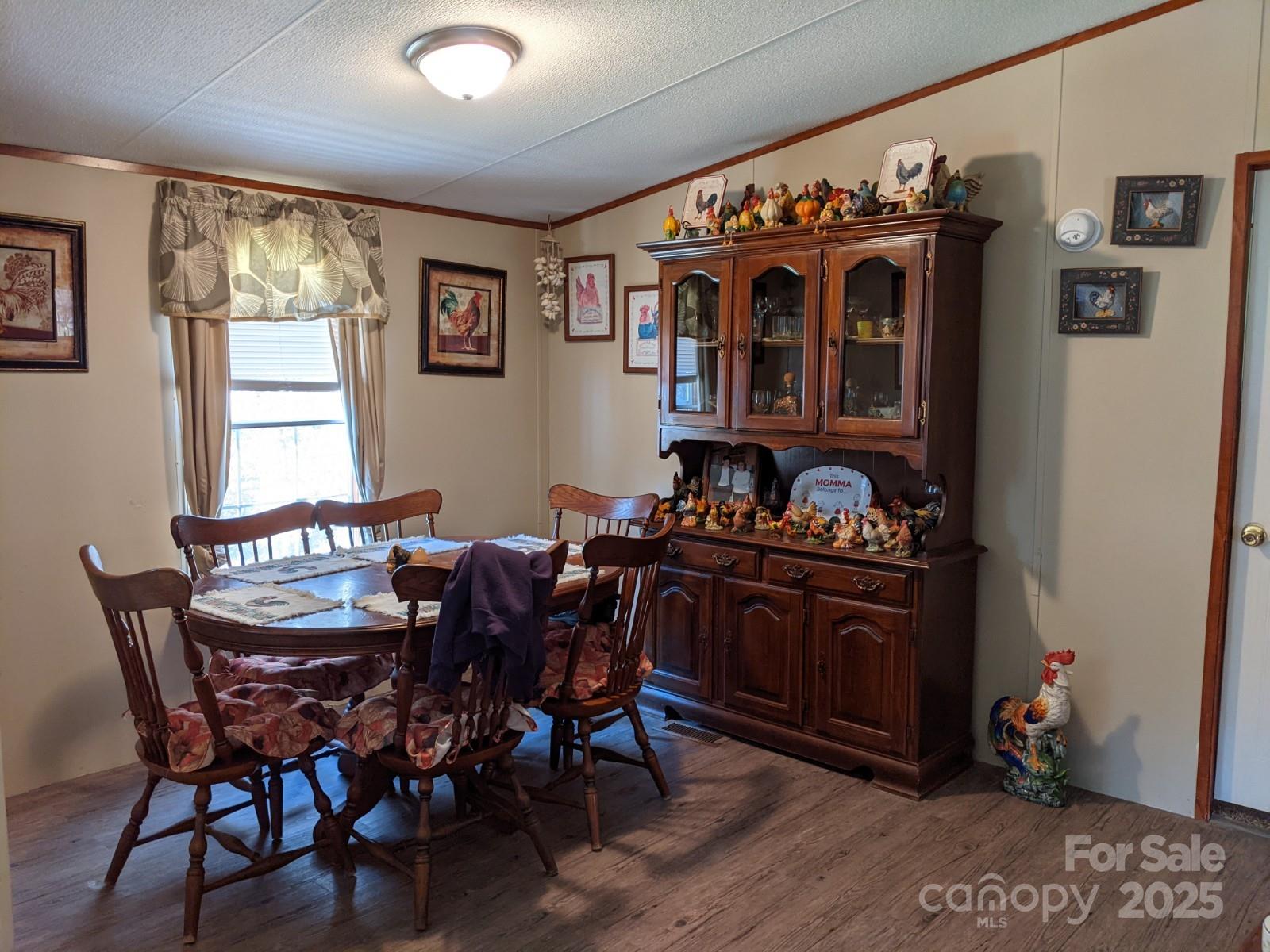 196 McKinney Road Weaverville, NC 28787 - Photo 7 of 20 a view of a dining room with furniture and chandelier