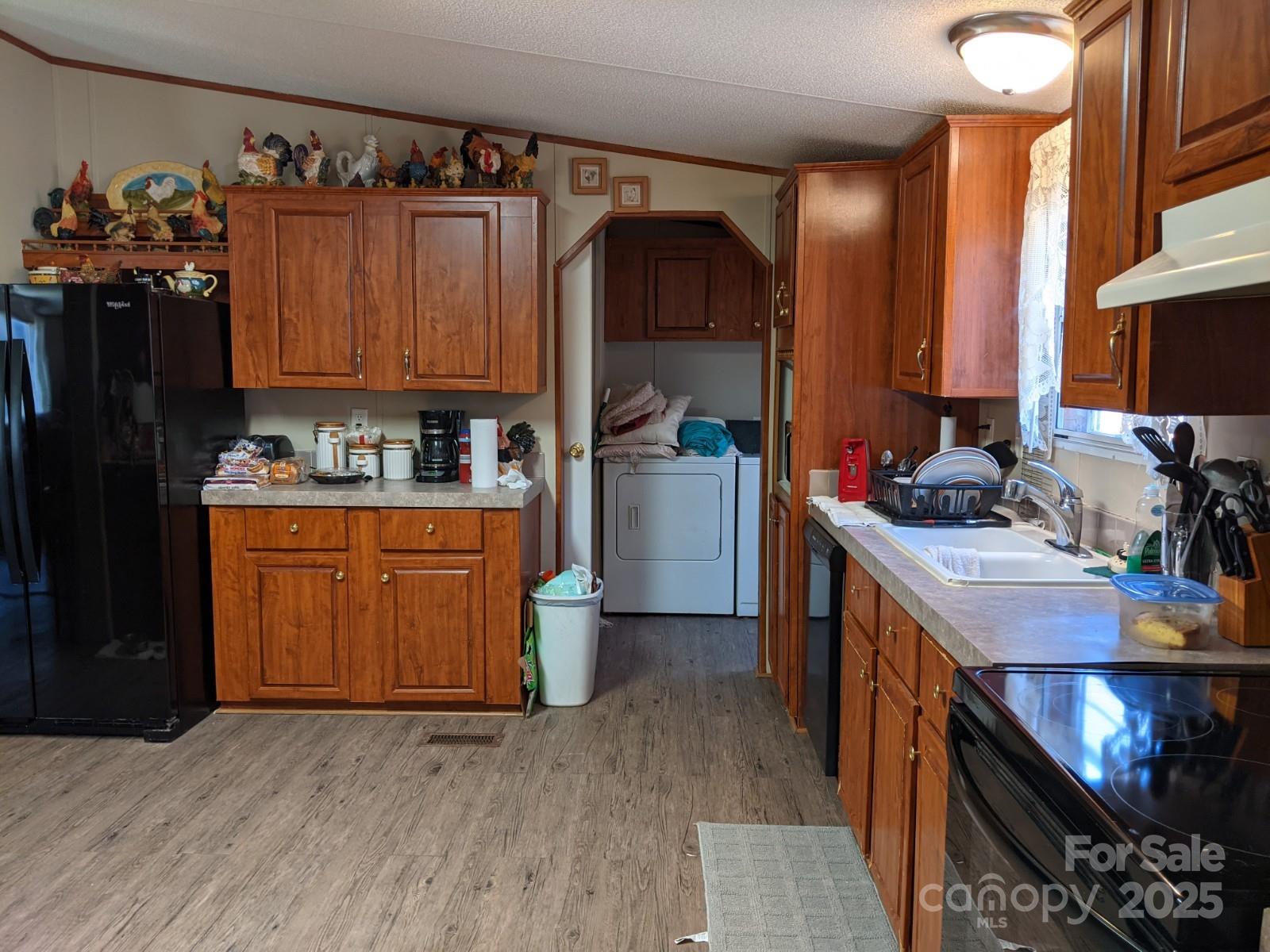 196 McKinney Road Weaverville, NC 28787 - Photo 8 of 20 a kitchen with a sink cabinets and wooden floor