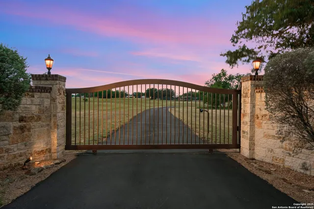 a front view of house with yard space and lake view