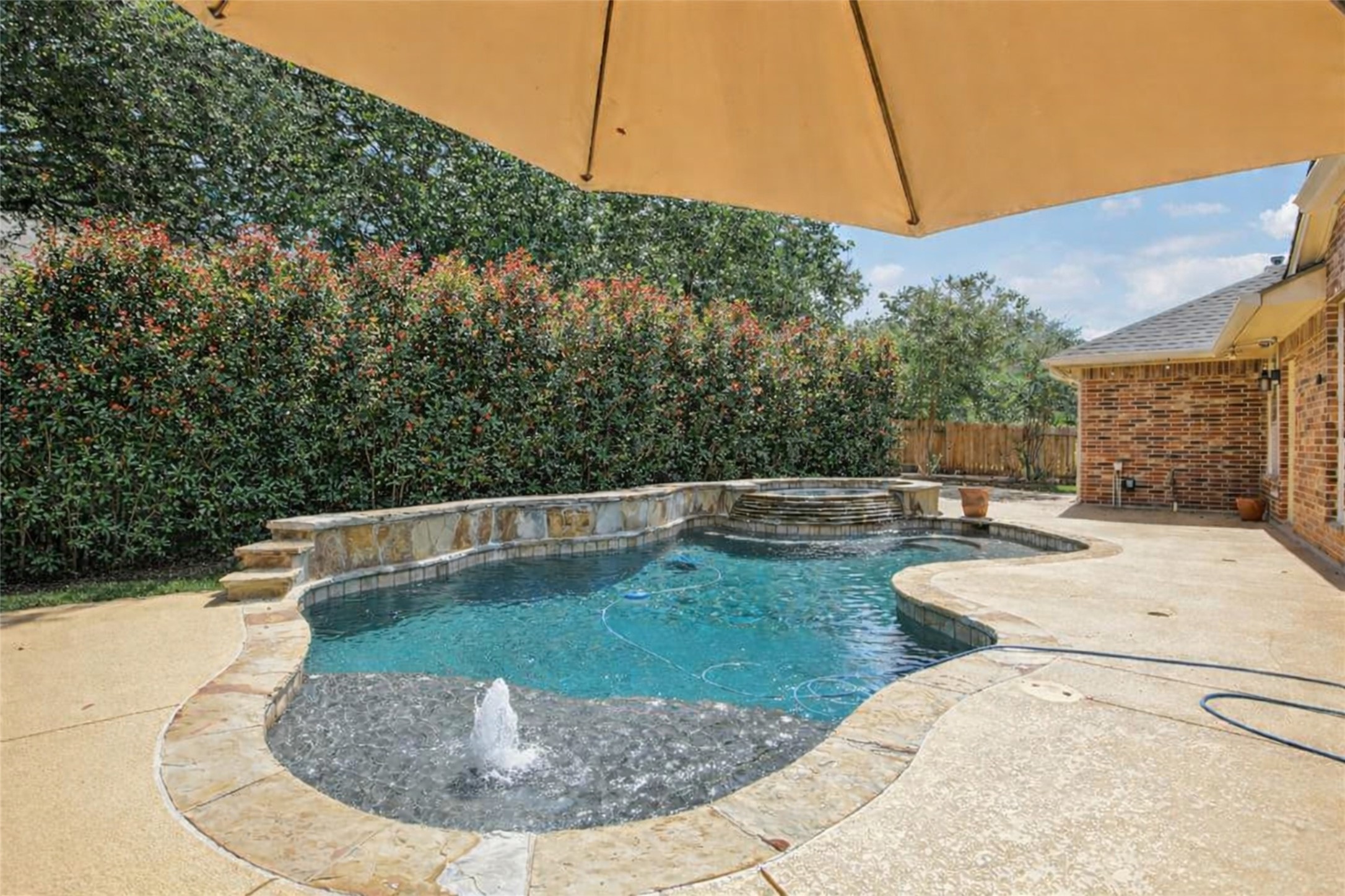 10525 Roy Butler Drive Austin, TX 78717 - Photo 34 of 40 Ai generated photo to show that bushes can be added for privacy. Seller will to give a landscaping allowance