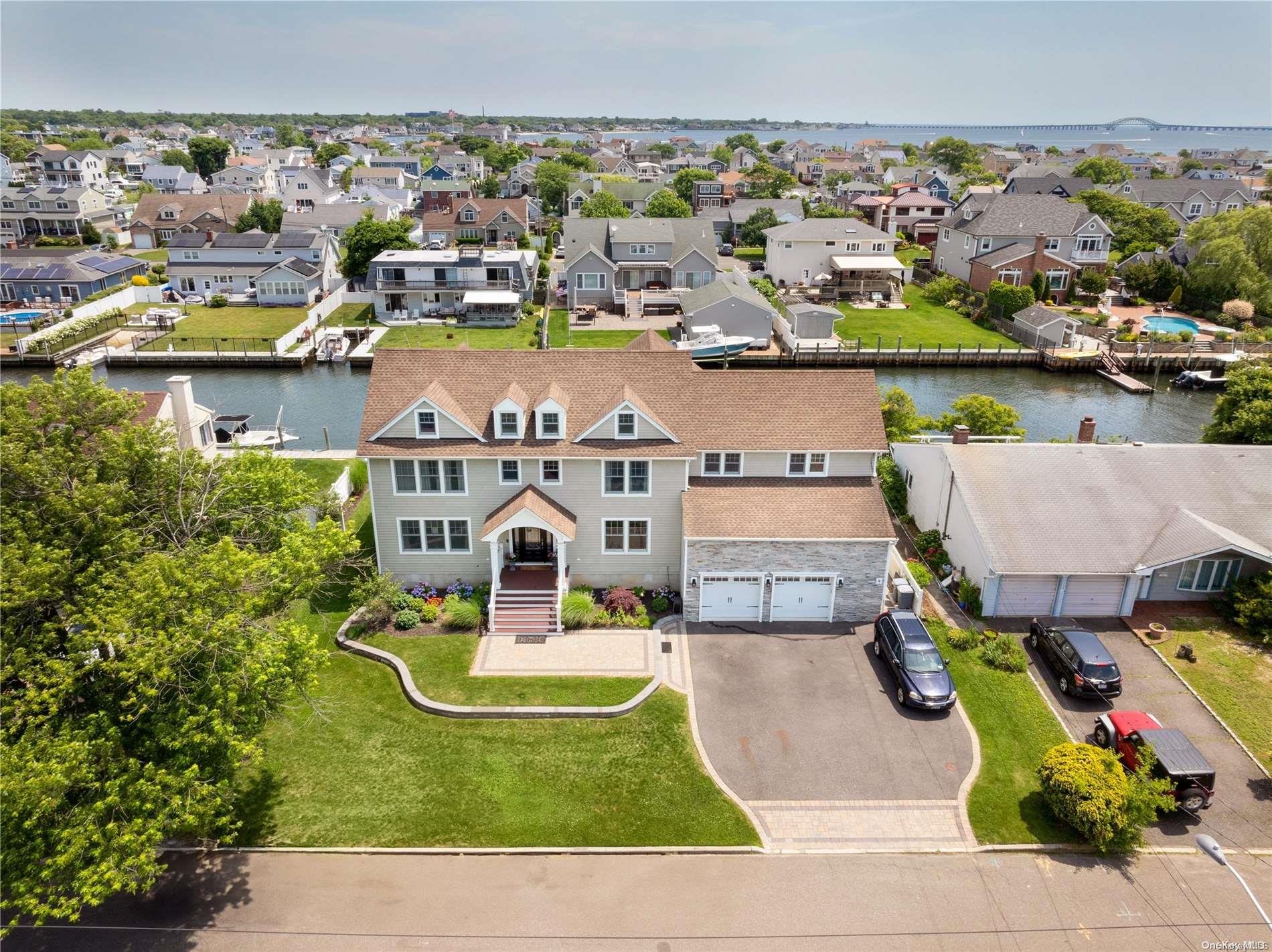an aerial view of residential houses with outdoor space and swimming pool