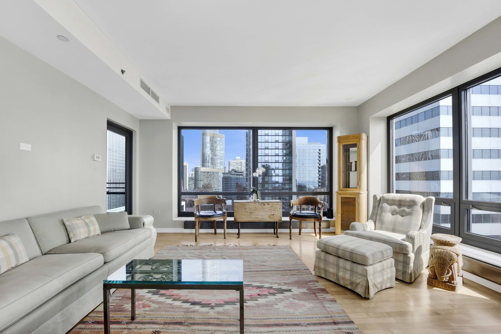 130 North Garland Court, Unit 3001 Chicago, IL 60602 - Photo 18 of 63 a living room with furniture and large windows